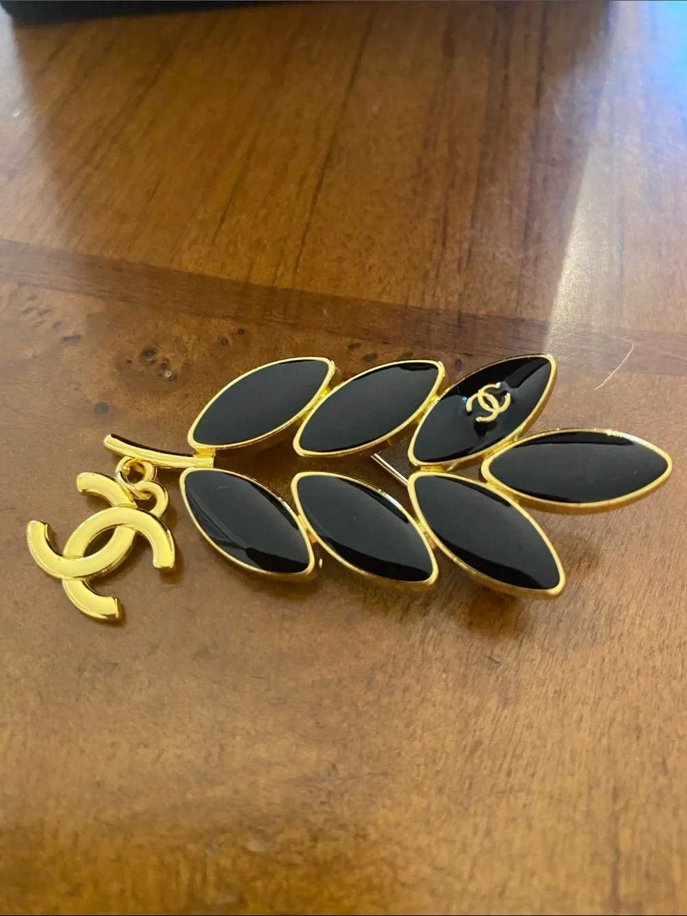 Fashion Jewelry Gold-Tone Leaf Brooch with Black Enamel and CC Logo Charm